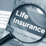 Life insurance concept with leaflets and magnifying glass in monochrome
