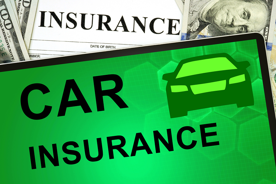Tablet with car insurance online and money. Insurance concept